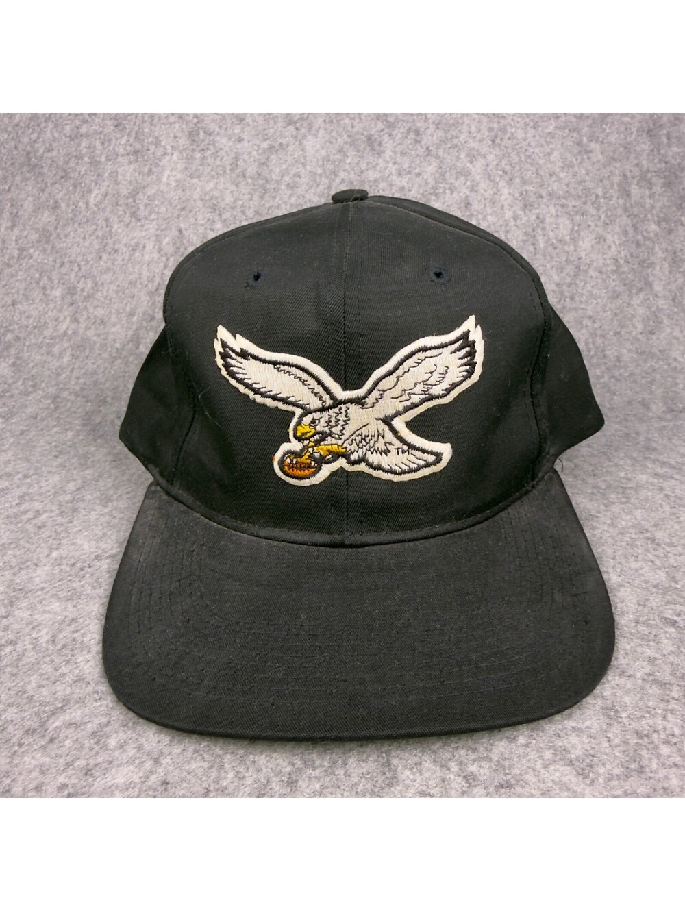 Vintage New Era Black Snapback Cap with Eagle Logo and Green Undervisor